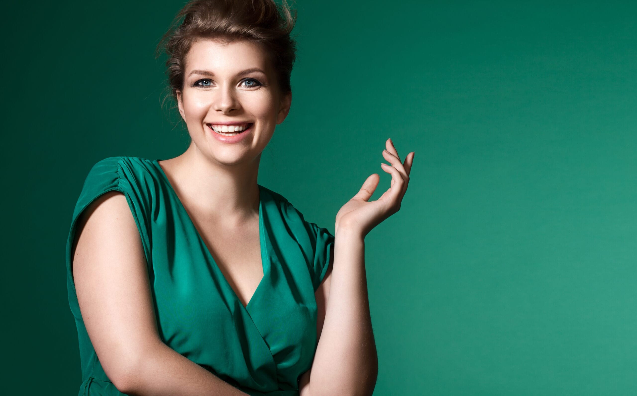 Happy woman in green background